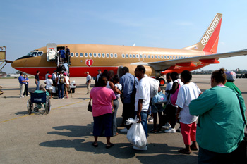 New Orleans, September 2, 2005 - A Southwest airliner boarding evacuees for transport to a shelter in San Antonio, TX. Many airliners from both civilian and military sources are working day and night to move evacuess left behind by Hurricane Katrina to selected sites throughout the nation. New Orleans is being evacuated due to flooding caused by hurricane Katrina. Photo by Win Henderson / FEMA photo.
