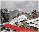 Debris from tornado surrounds Safe Room.