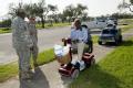 National Guardmen watch residents leave a distribution site in Texas
