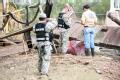 New Mexico National Guardsmen checking drums for toxic materials in Texas