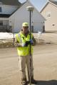 Fargo Engineer uses a GPS to measure the height of the river
