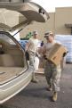 Texas National Guardsman delivers MREs to a car in Texas