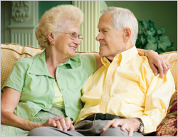 Older couple sitting on a sofa
