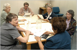 Early-stage Alzheimer’s support group meeting at a table