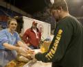 Salvation Army worker giving food to a volunteer in Fargo, North Dakota