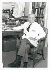 [Victor McKusick at his desk as Chairman of the Department of Medicine, Johns Hopkins University Hospital]. [ca. 1985].