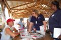 FEMA community relations workers talking to a resident in Iowa