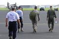 Texas Task Force 1 and Texas Army National Guard walking to helicopters