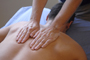 a photo of a man receiving a back massage.