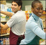 Photo: A man and woman stocking shelves