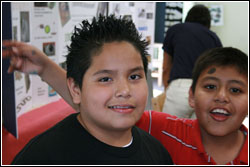 LOS ANGELES, Feb. 7, 2008--Two fourth grade buddies celebrate after receiving FEMA Disaster Action Kid certificates at Frank Del Olmo Elementary School in Los Angeles.  The two were among 64 students at the school who participated in the FEMA for Kids emerge. photo by Stuart M. George
