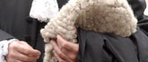 A lawyer with gown and wig