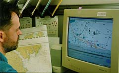 cartographer preparing an electronic navigation chart