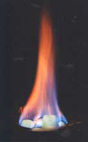 The methane from a piece of gas hydrate burns.