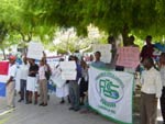 Photo of Dominican residents marching through town promoting environmental awareness.