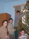 photo of children decorating tree