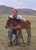 Jonathan Phillips holding a three-day-old horse