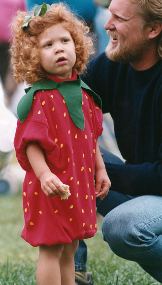 Photo of child in strawberry costume