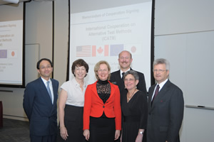 Participants gathered for a group photo. Shown left to right are Hajime Kojima, Birnbaum, Anklam, Stokes, in uniform, Wind and Blakey.