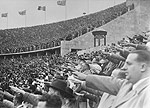 German citizens saluting Adolf Hitler at the opening of the 11th Olympiad in Berlin. The pageantry and propaganda of the German government was a contributing factor to the Holocaust, but many other factors also were of equal or greater importance.