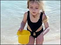 Photo of little girl on beach.