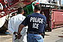 Photo of ICE agent arrest crew member of Caribbean Corridor Initiative operation