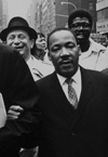 Martin Luther King, Jr. with Dr. Spock on the left and Reverend Rice (with the hat) on the right. PHoto by Benedict Fernandez
