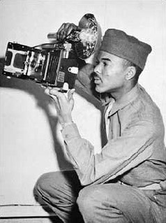 African Americans were among the liberators of the Buchenwald concentration camp. William Scott, seen here during training, was a military photographer and helped document Nazi crimes in the camp. Alabama, United States, March 1943.