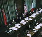 The International Military Tribunal was a court convened jointly by the victorious Allied governments. Here the Soviet, British, American, and French flags hang behind the judges' bench.