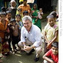 Mullaney with children in Bangladesh. During a 2006 visit, Mullaney visited the homes of cleft patients in poor, rural villages