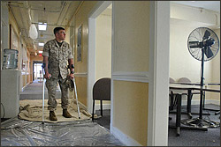 Marine Capt. Ray Baronie, commander of Company A, Wounded Warrior Battalion East, Camp Lejeune, N.C., walks through his barracks inspecting renovations. Baronie was injured when an anti-tank round struck his vehicle in Iraq in 2005. Baronie decided to stay on active duty because he felt he could still contribute to the mission. While he was still in the hospital officials asked if he would consider an assignment leading other wounded Marines. DoD photo by Fred W. Baker III