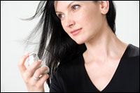 Photo: A woman holding an inhaler