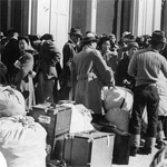 Residents of Japanese ancestry awaiting the bus