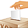 Voter's hand dropping a ballot