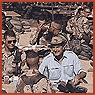 Detail of Photograph of President George H. W. Bush Enjoying Thanksgiving Dinner with Troops, 11/22/1990  (ARC ID 186423)