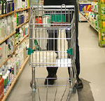 In the U.S., a shopping cart; in Britain, a trolley