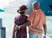 Photo of couple in front of a cruise ship