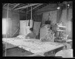 Grandmother from Oklahoma with Grandson, Working on Quilt