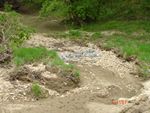 Location 42 - Little Elk Creek looking downstream from SR 279 bridge - quarry spalls in highwater side channel (buried utilities?)