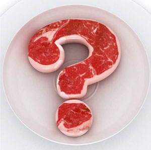 Question mark made of raw meat.