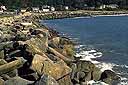 Large boulders line shore