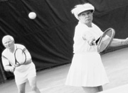 Photo of elderly couple playing tennis