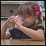 Photo: A gril drinking water