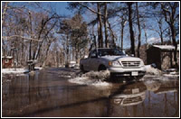 Truck drives on flooded street. FEMA Photo