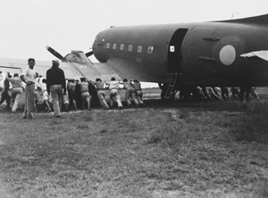 A Royal Air Force Dakota supporting operations in Thailand had to be unstuck the old-fashioned way at a secret air strip in June 1945.