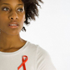 Photo of woman wearing AIDS ribbon