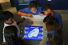 Anatomy of an atoll kiosk with school children looking on.