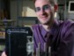 Grad student in laboratory with his laptop-size invention, the Mini-Z