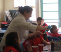 Photo of Susannah Gordon-Messer demonstrating how to make slime.