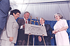 On June 9, 1999, HHS Secretary Donna Shalala, President Bill Clinton, Arkansas Sen. Dale Bumpers, and Mrs. Betty Bumpers unveil the cornerstone to the Dale and Betty Bumpers Vaccine Research Center.